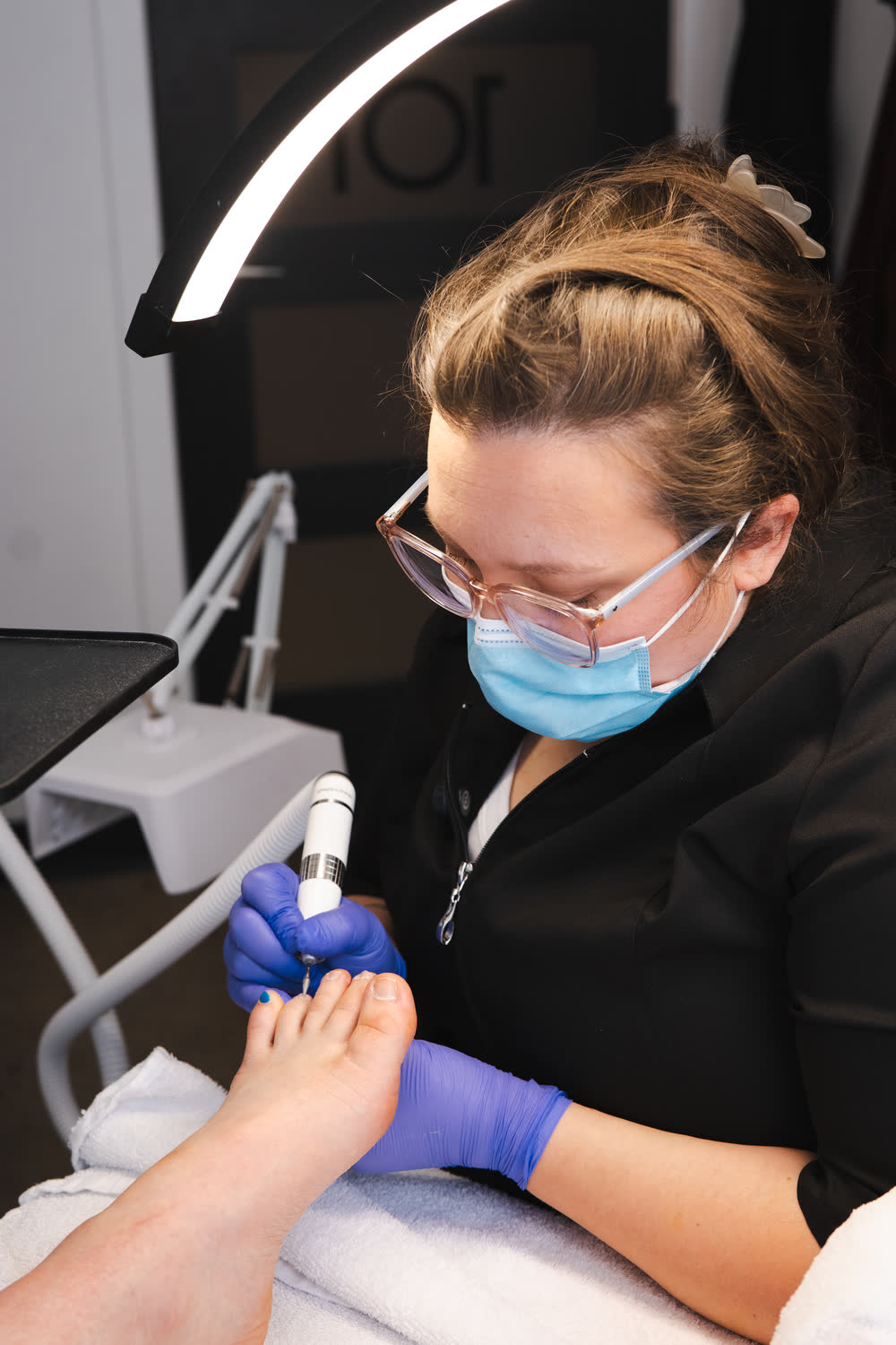 Vanessa giving foot care in her office